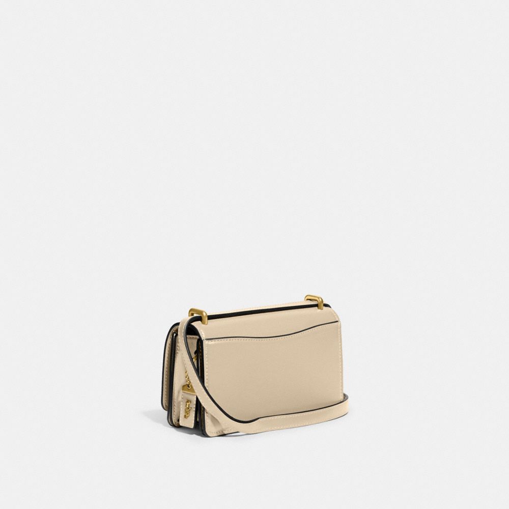 Shop Coach Bandit Umhängetasche In Brass/ivory