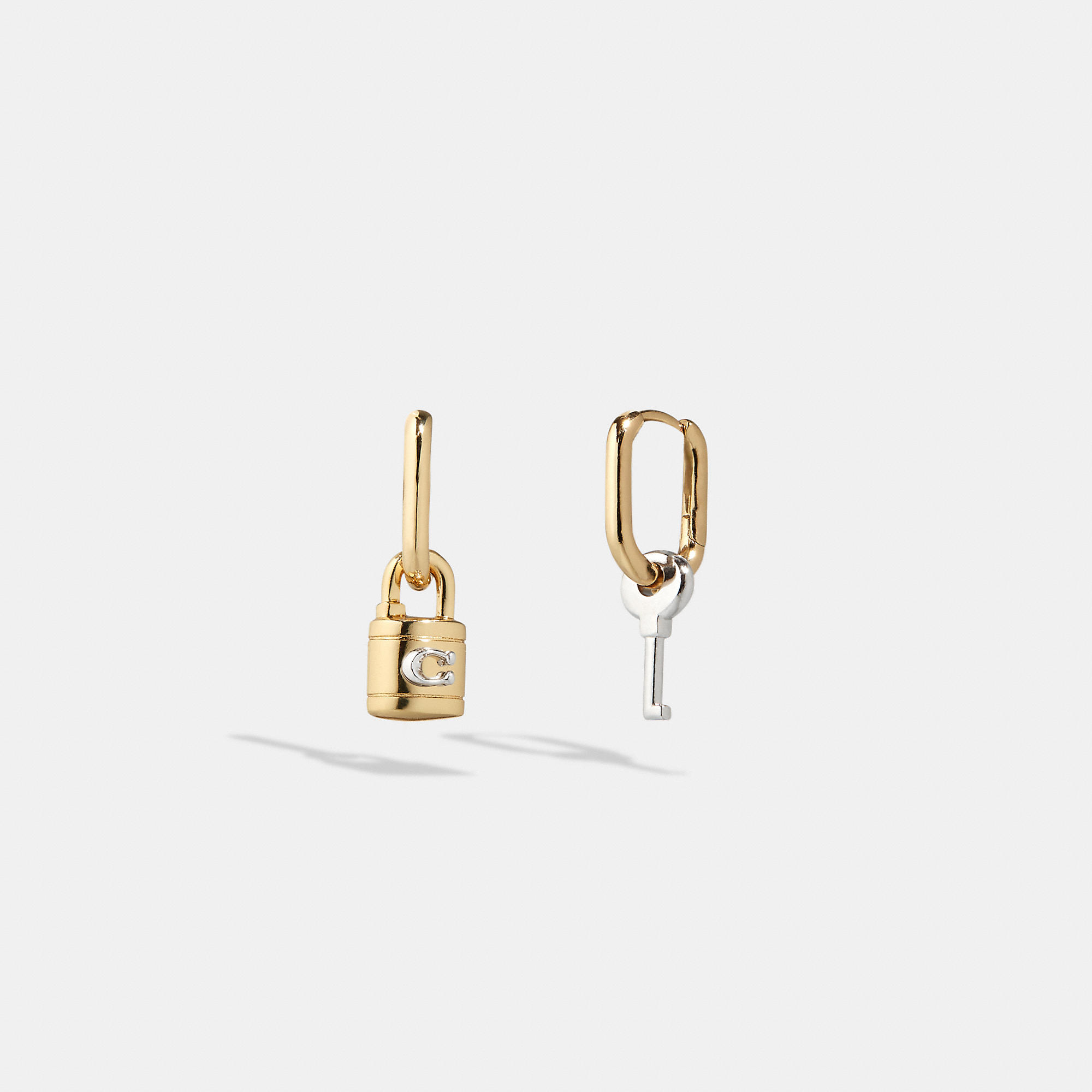 Shop Coach Outlet Signature Padlock And Key Mismatch Earrings In Yellow