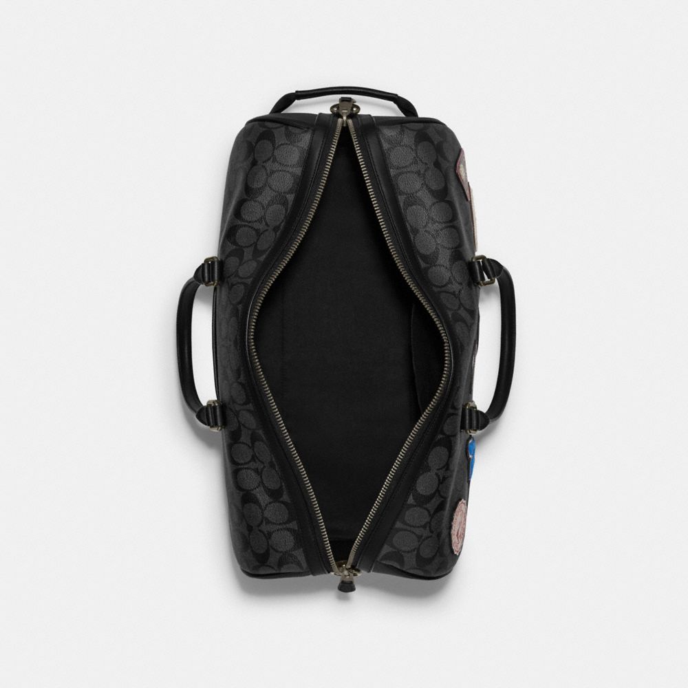 venturer bag in signature canvas with ski patches