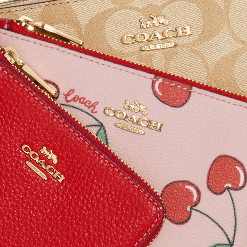 COACH METALLIC CHERRY DOUBLE ZIP PHONE WALLET lnx.beemet.it
