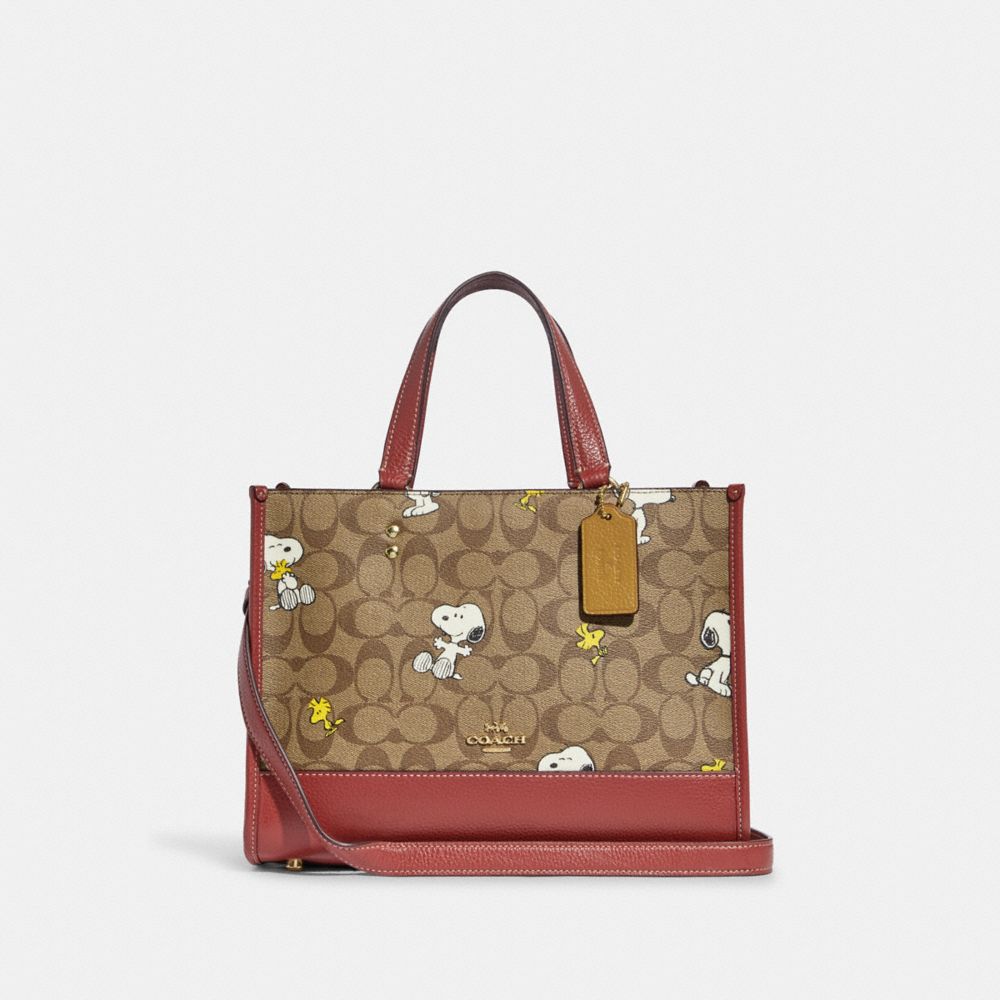 COACH X PEANUTSデンプシー キャリーオールシグネチャースヌーピー-