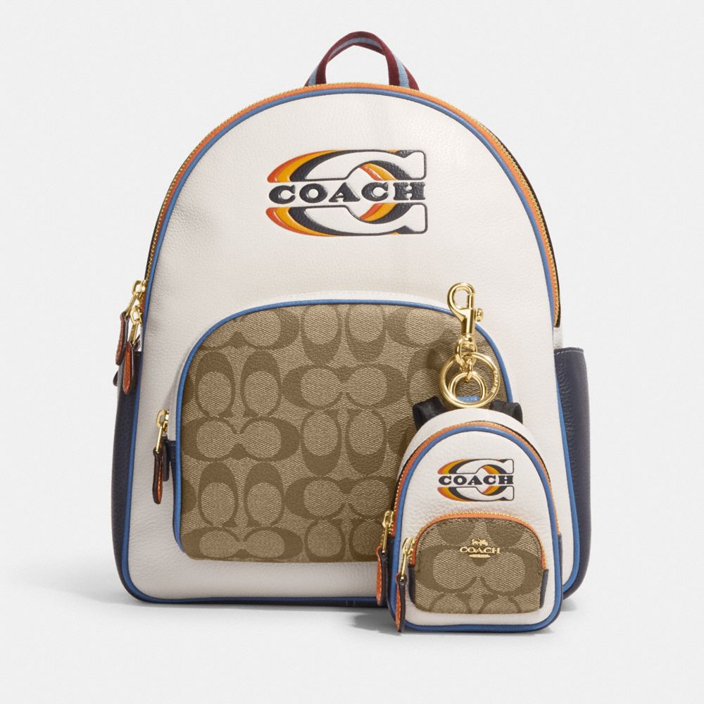 COACH® | Mini Court Backpack Bag Charm In Signature Canvas With Coach Stamp