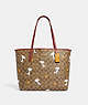 Coach X Peanuts City Tote In Signature Canvas With Snoopy Woodstock Print