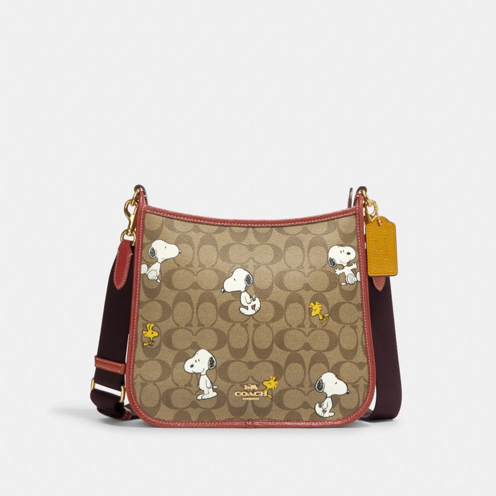 Coach Coach X Peanuts Dempsey File Bag In Signature Canvas With Snoopy ...