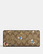 COACH®,SLIM WALLET IN SIGNATURE CANVAS WITH CAT MITTENS PRINT,Signature Coated Canvas,Gold/Khaki Multi,Front View