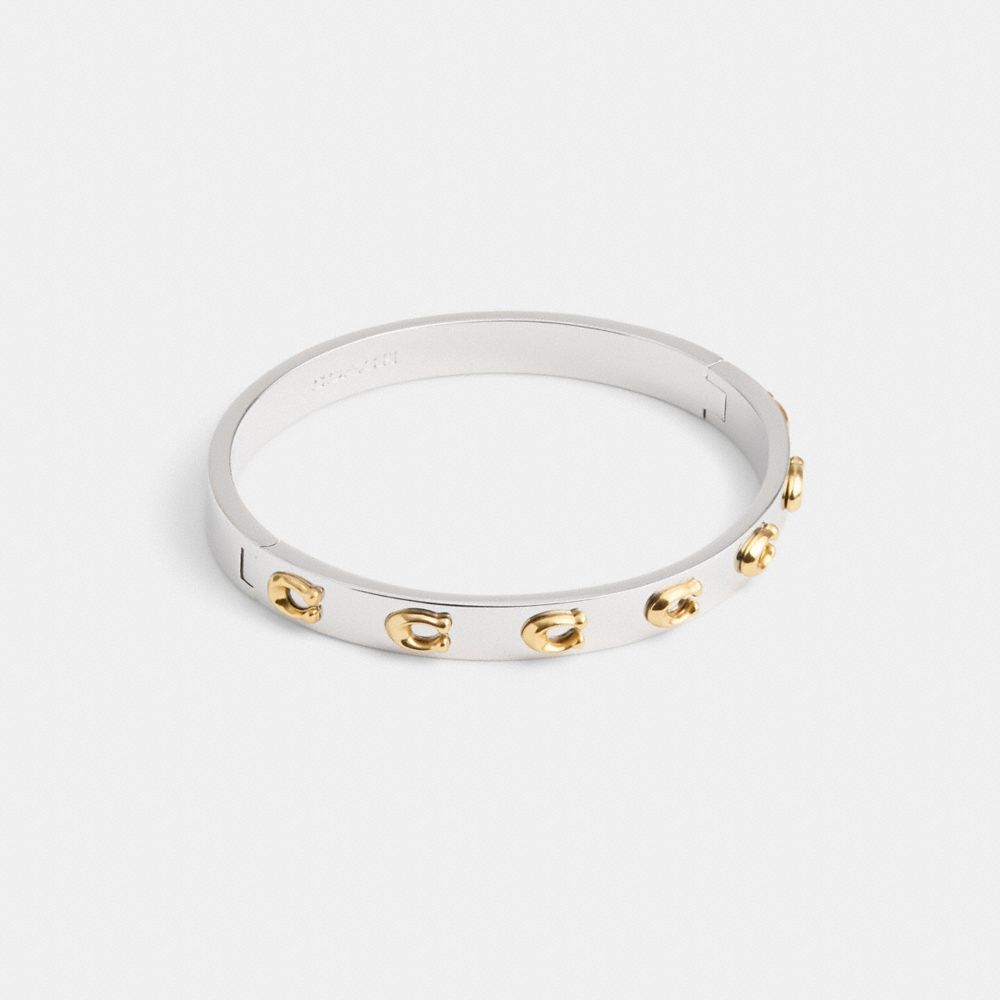 Coach Pegged Signature Hinged Bangle In Gold/silver