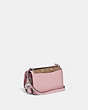 COACH®,LUNAR NEW YEAR BANDIT CROSSBODY IN COLORBLOCK SIGNATURE CANVAS WITH RABBIT CHARM,canvas,Silver/Tan Powder Pink,Angle View