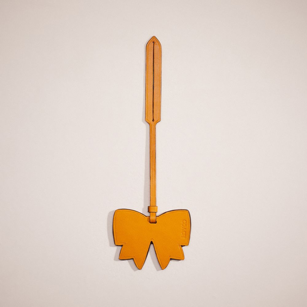 Coach Remade Bow Bag Charm In Ochre