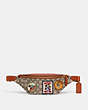 COACH®,DISNEY X COACH CHARTER BELT BAG 7 IN SIGNATURE TEXTILE JACQUARD WITH PATCHES,Signature Jacquard,Small,Cocoa Multi,Front View