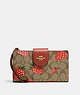 COACH®,PHONE WALLET IN SIGNATURE CANVAS WITH WILD STRAWBERRY PRINT,Gold/Khaki Multi,Front View
