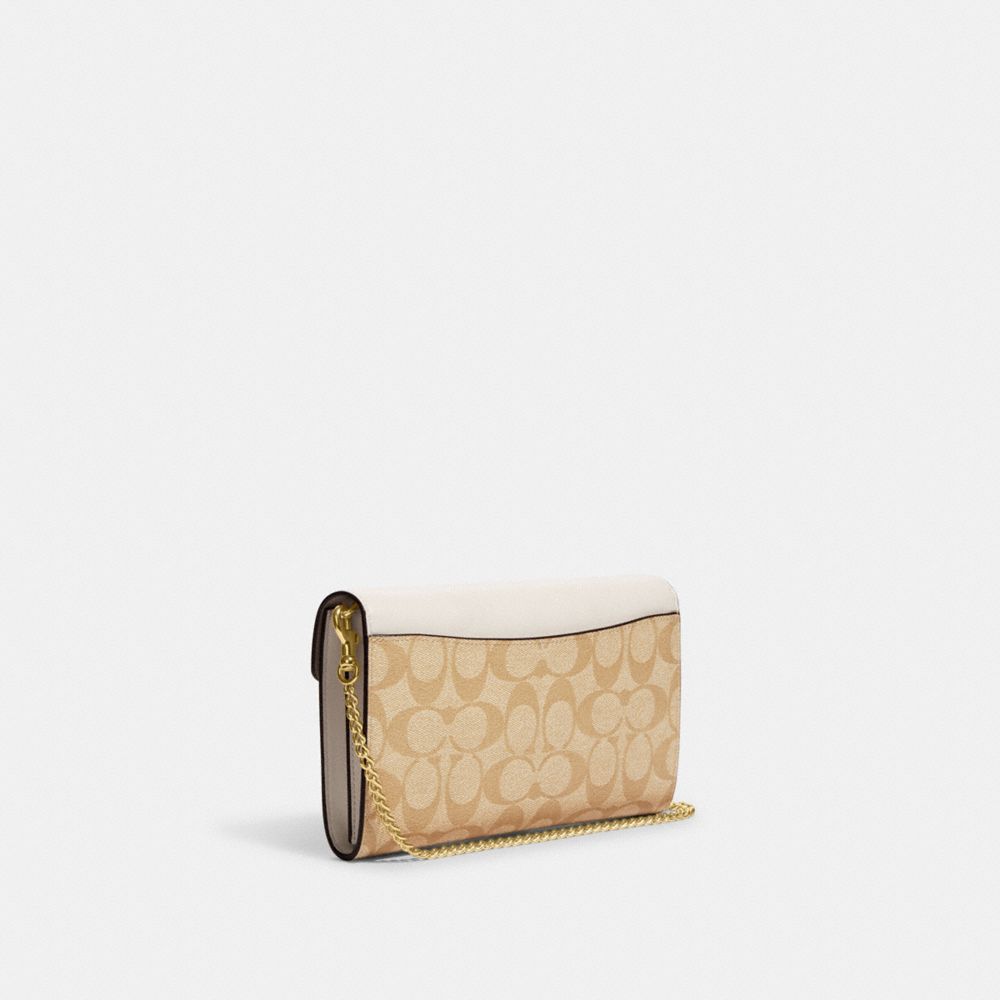 COACH®,Envelope Clutch Crossbody In Signature Canvas,,Angle View