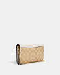 COACH®,ENVELOPE CLUTCH CROSSBODY IN SIGNATURE CANVAS,Gold/Light Khaki Chalk,Angle View