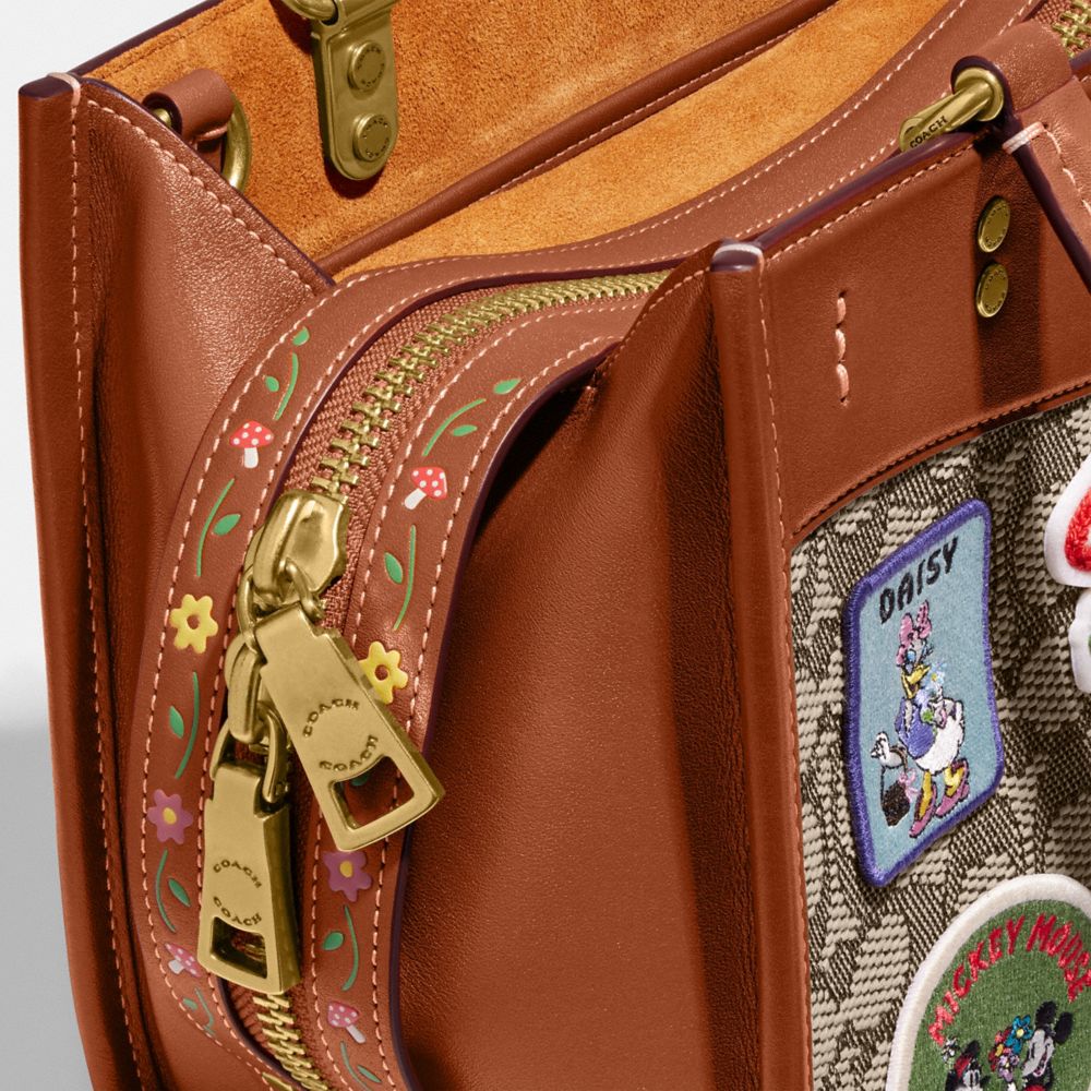 COACH®: Disney X Coach Rogue 25 In Signature Textile Jacquard