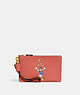 Disney X Coach Small Wristlet In Regenerative Leather With Daisy Duck