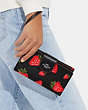 COACH®,PHONE WALLET WITH WILD STRAWBERRY PRINT,Leather,Silver/Black Multi,Detail View