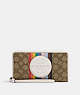 COACH®,DEMPSEY LARGE PHONE WALLET IN SIGNATURE JACQUARD WITH RAINBOW STRIPE AND COACH PATCH,Jacquard,Silver/Khaki Multi,Front View