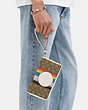 COACH®,DEMPSEY LARGE PHONE WALLET IN SIGNATURE JACQUARD WITH RAINBOW STRIPE AND COACH PATCH,Jacquard,Silver/Khaki Multi,Detail View