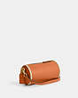 COACH®,ORION BARREL BAG,Polished Pebble Leather,Small,Brass/Faded Orange,Angle View