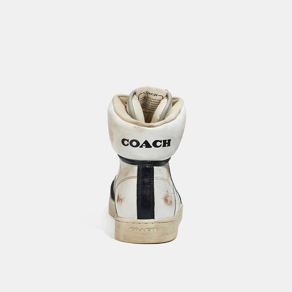 Shop Coach Distressed High Top Sneaker In White & Black