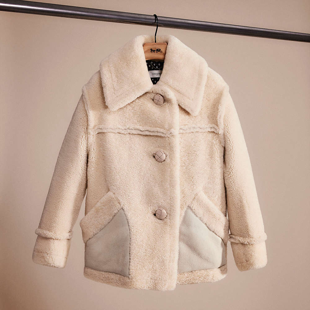 Coach Restored Short Shearling Coat With Printed Lining In Vintage White