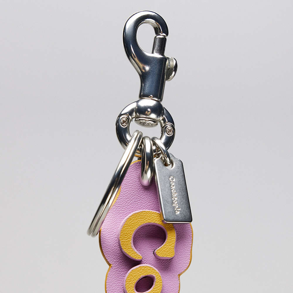 Shop Coach Topia Bag Charm In Topia Leather In Violet Orchid/flax
