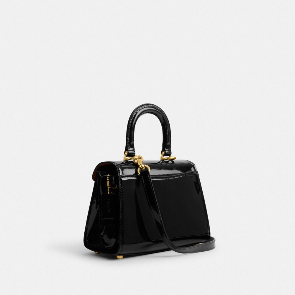 COACH®,SAMMY TOP HANDLE 21,Patent Leather,Small,Brass/Black,Angle View