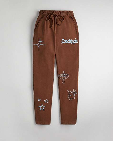 COACH®,Graphic Jogger Pants in 93% Recycled Cotton,Dark Brown,Front View