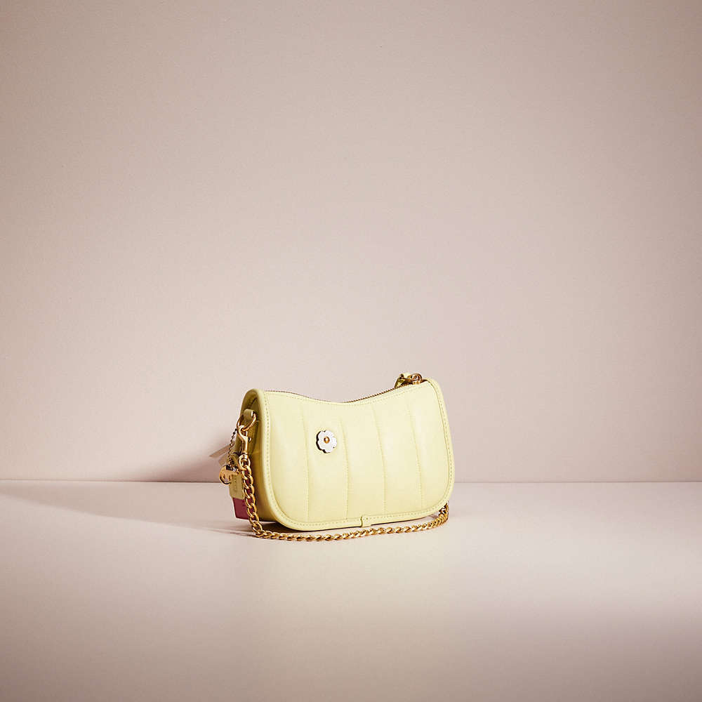 Shop Coach Upcrafted Swinger 20 With Quilting In Brass/pale Lime