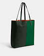 COACH®,NOMAD TOTE IN COLORBLOCK,Large,Brass/Green Multi,Angle View