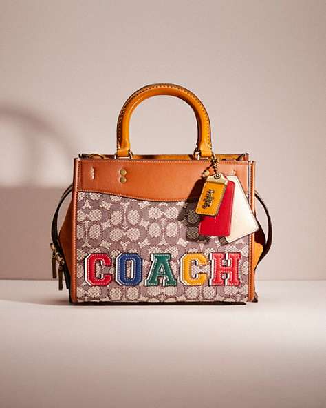 COACH®,UPCRAFTED ROGUE 25 IN SIGNATURE TEXTILE JACQUARD,School Spirit,Brass/Cocoa Burnished Amb,Front View
