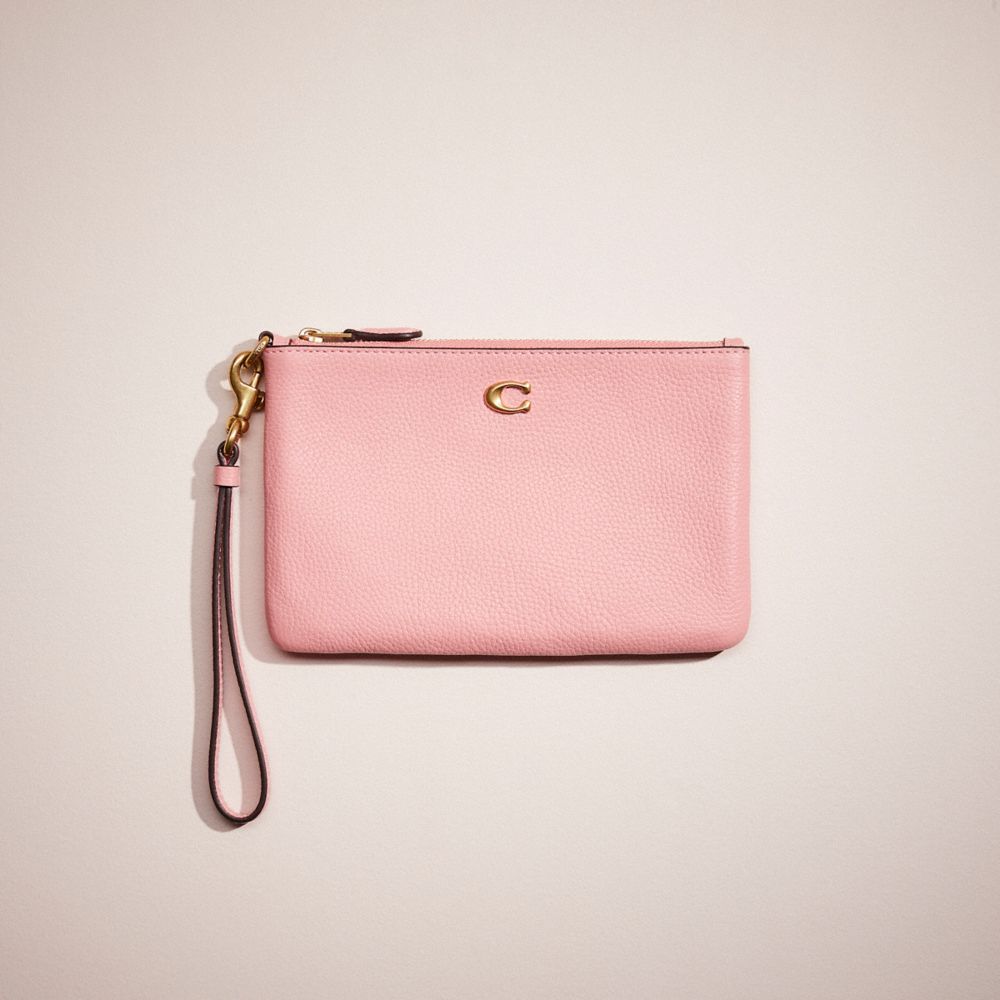 Coach Restored Small Wristlet In Brass/bubblegum