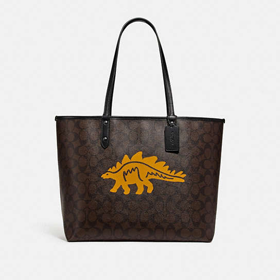 COACH® Outlet | Reversible City Tote In Signature Canvas With Dinosaur Motif